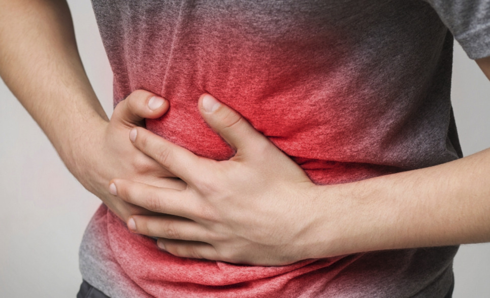 bild på person med ont i magen