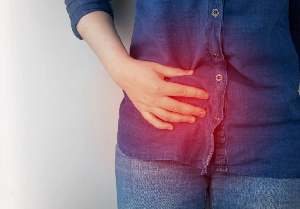 person med ont i bäcken