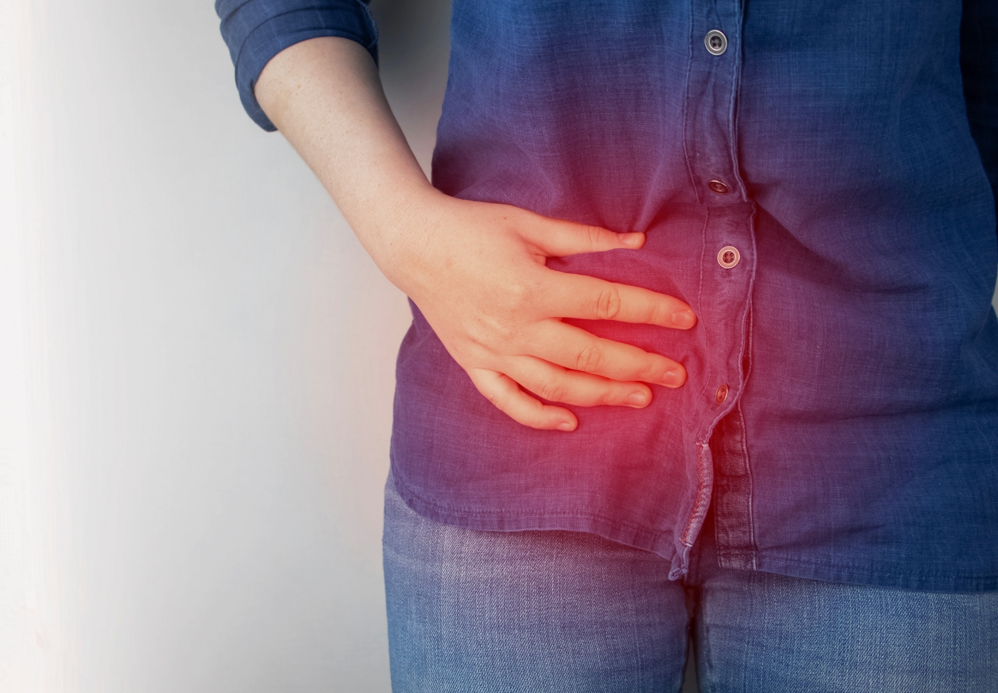 person med ont i bäcken